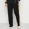 Karl Kani Vendre-Réclame TRACKPANTS - Pantalon de survêtement joggings haute male