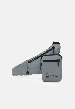 Karl Kani Prix Acceptable SIGNATURE REFLECTIVE CROSSBODY BAG - Sac bandoulière sacs fermeture éclair unisex