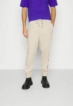 Karl Kani Prix Dynamité SIGNATURE UNISEX - Pantalon de survêtement joggings normale