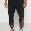 Karl Kani SMALL SIGNATURE BLEACHED UNISEX - Pantalon de survêtement Prix Jamais Vus joggings haute