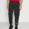 Karl Kani Prix Aimable SIGNATURE PINSTRIPE PANTS UNISEX - Pantalon de survêtement joggings normale 2 Karl Kani Prix Aimable SIGNATURE PINSTRIPE PANTS UNISEX - Pantalon de survêtement joggings normale -Karl Kani Soldes Boutique d3722176a64444719bbe6dd0e95ffdcf