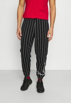 Karl Kani Prix Aimable SIGNATURE PINSTRIPE PANTS UNISEX - Pantalon de survêtement joggings normale